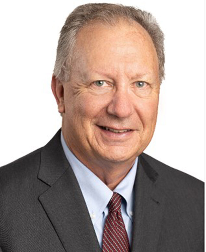 Peter Attarian, Jr. in professional attire, smiling, showcasing expertise in business and real estate law, associated with Dillon, Miller, Ahuja, & Boss LLP.