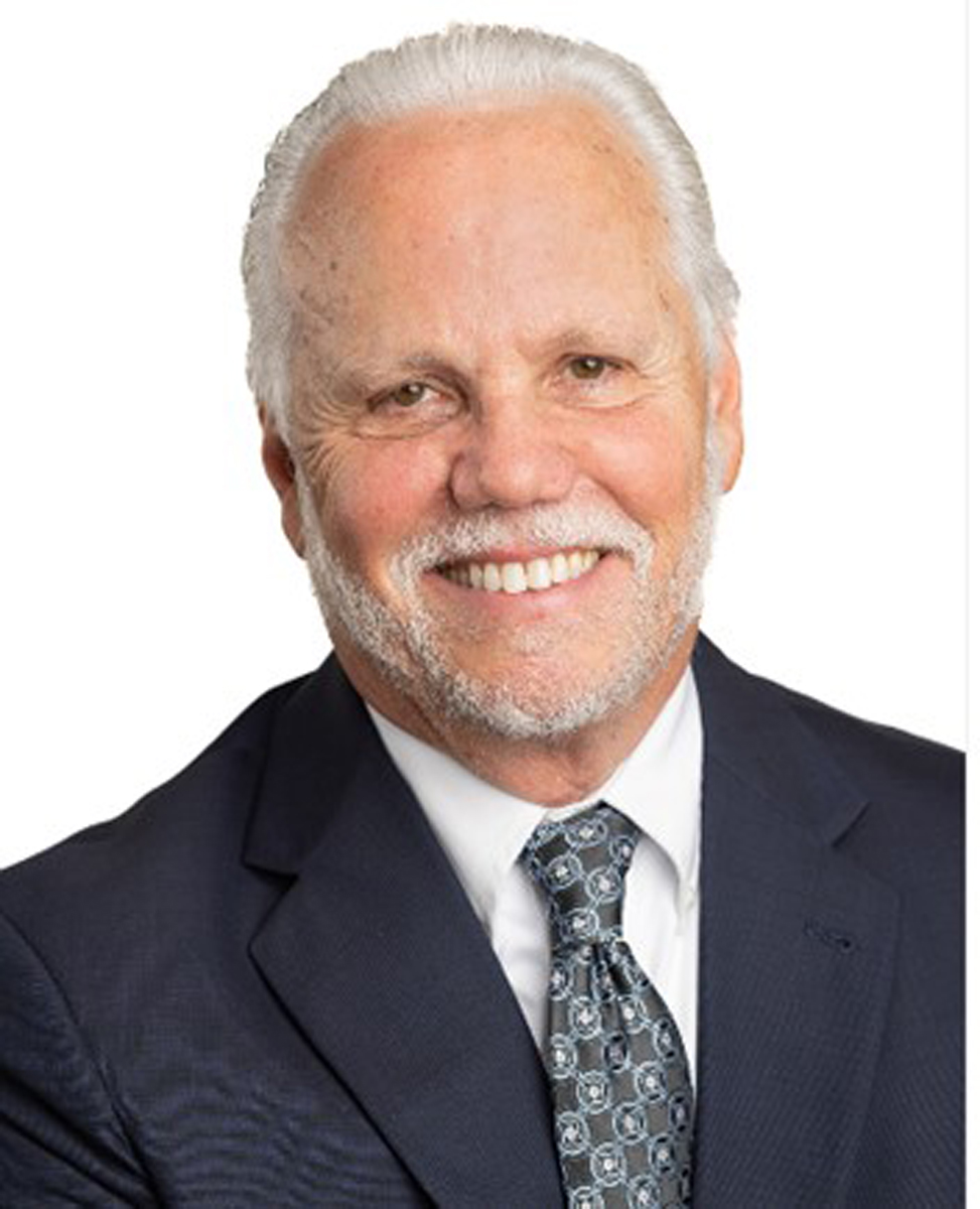 Timothy D. Principe, partner at Dillon, Miller, Ahuja, & Boss LLP, smiling in professional attire, emphasizing expertise in civil litigation and real estate law.