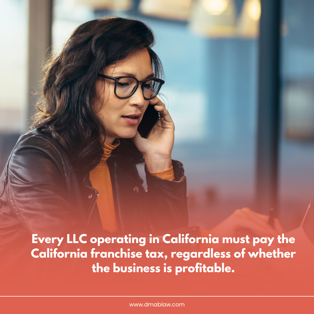 Woman on phone in a caf&eacute; discussing California LLC franchise tax obligations, emphasizing annual costs regardless of profitability.