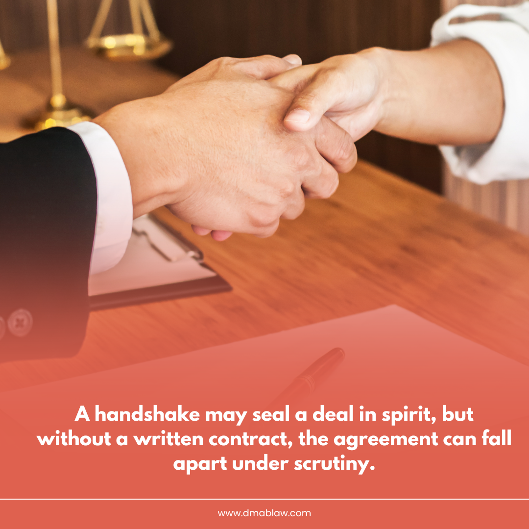 Handshake between two individuals over a wooden desk, emphasizing the importance of written contracts to avoid disputes, with a blurred background of legal scales and office setting.