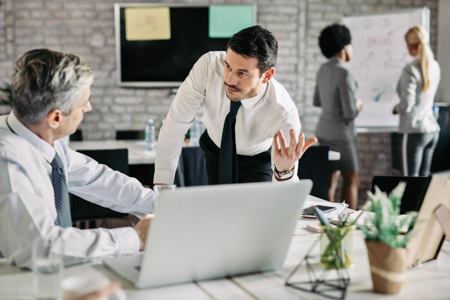 business attorney near me Carlsbad Business partners engaged in a serious office discussion about corporate disagreements