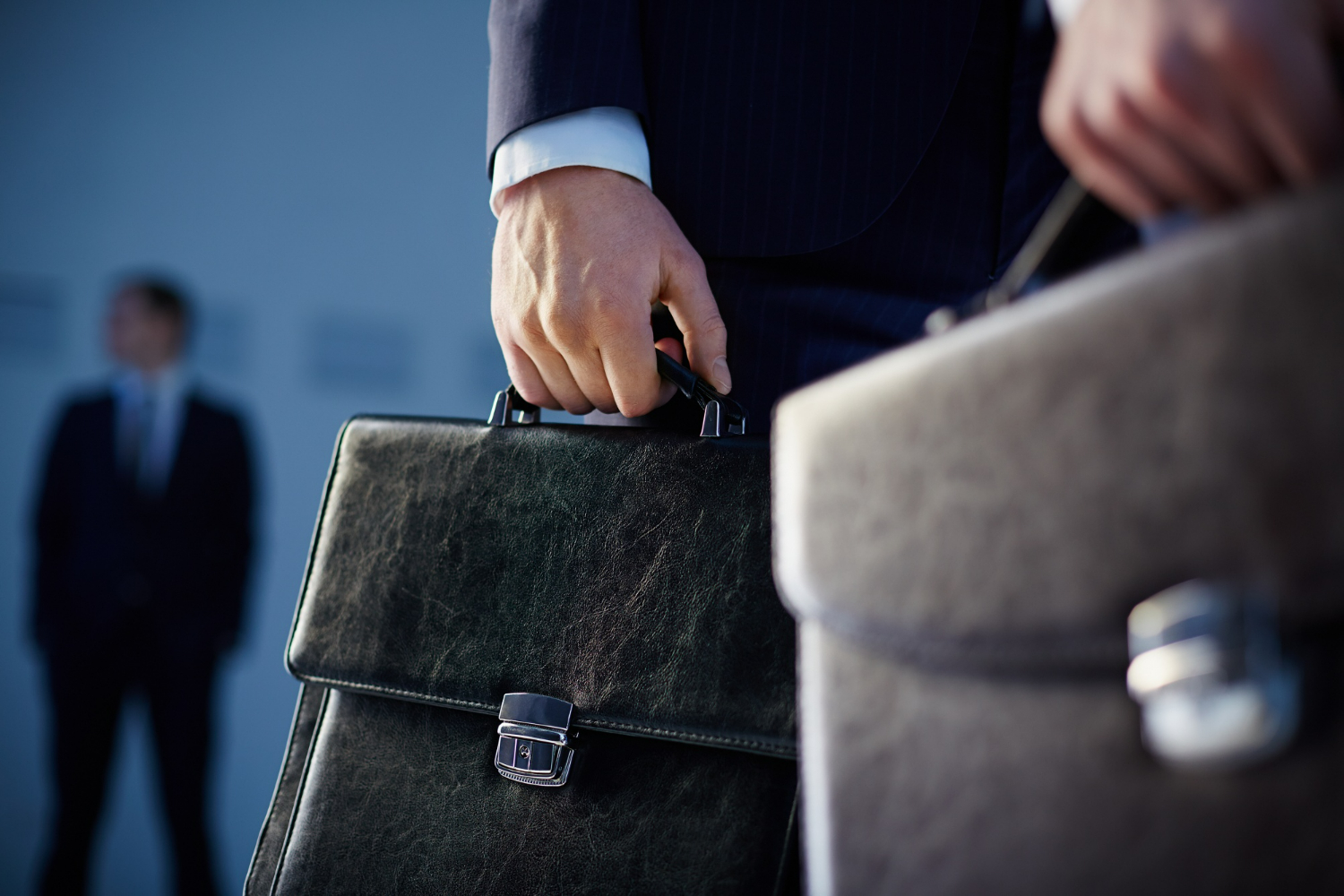 A legal professional carrying a briefcase while preparing for a business dispute meeting or commercial litigation proceeding
