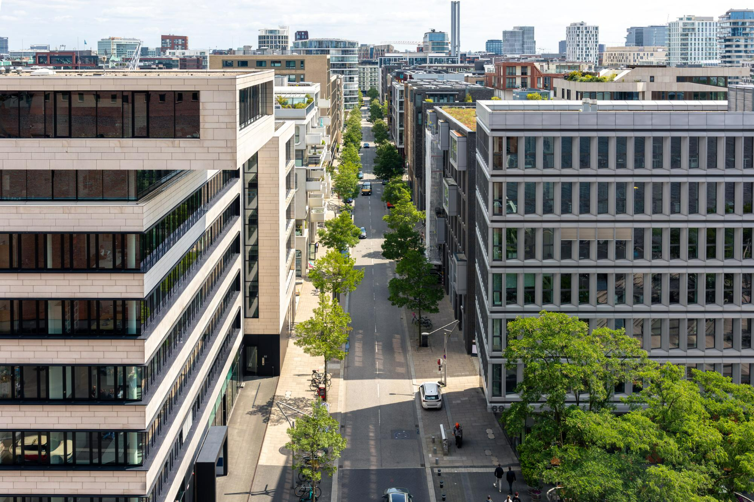 Aerial view of a modern mixed-use urban district with commercial and residential buildings