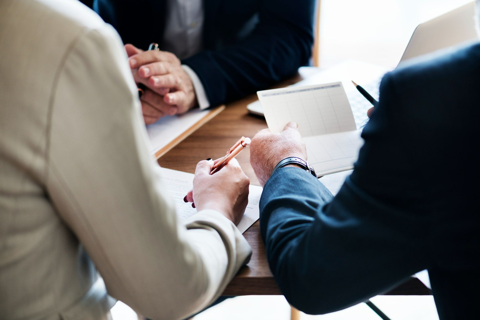Carlsbad business attorney Business owner meeting with a California business attorney to review legal documents and discuss company formation and legal strategy