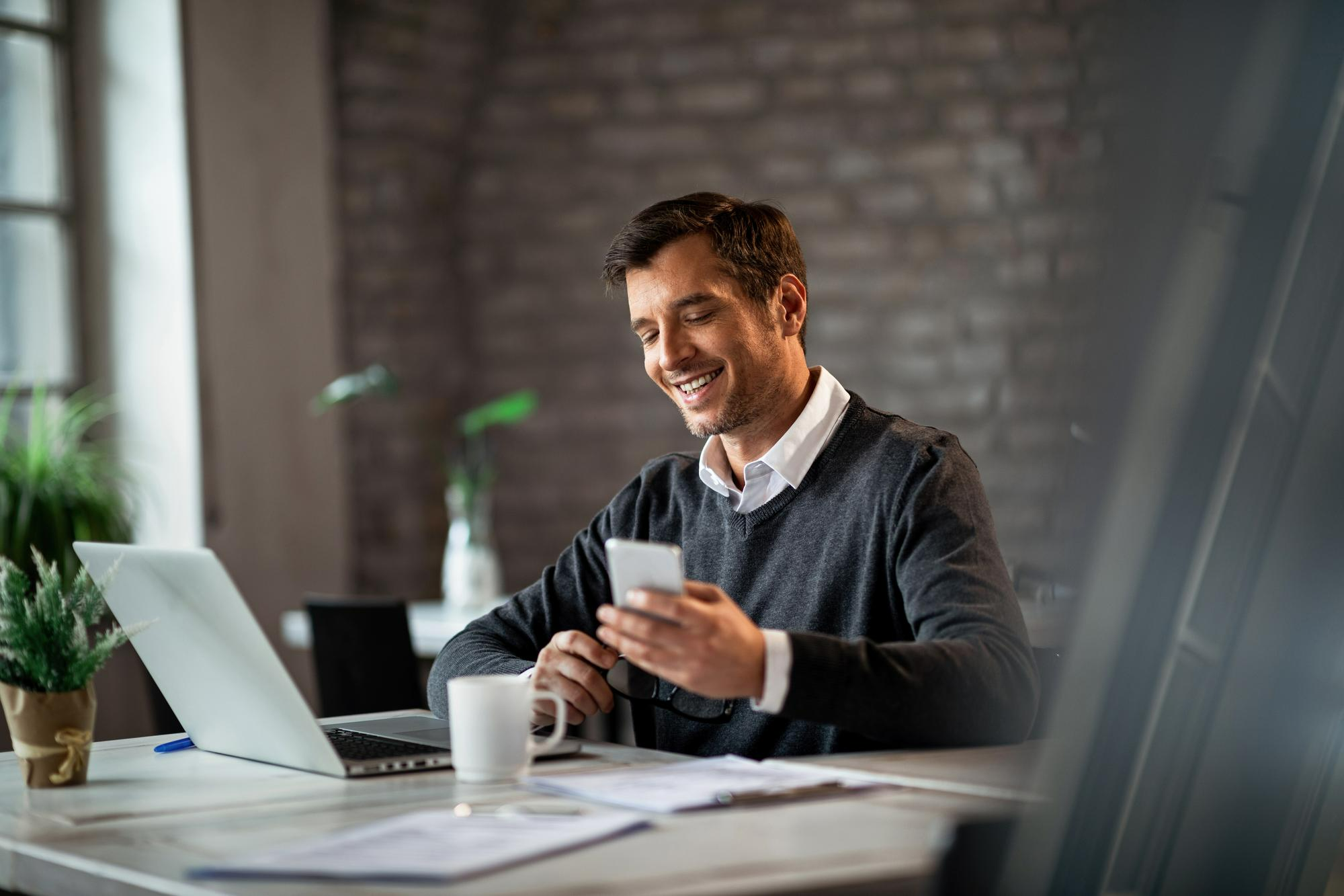 Small business owner researching how to choose a business attorney in California while working from a home office